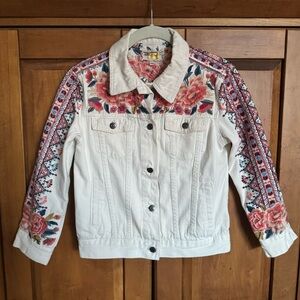 Johnny was white denim jacket with embroidered floral detail